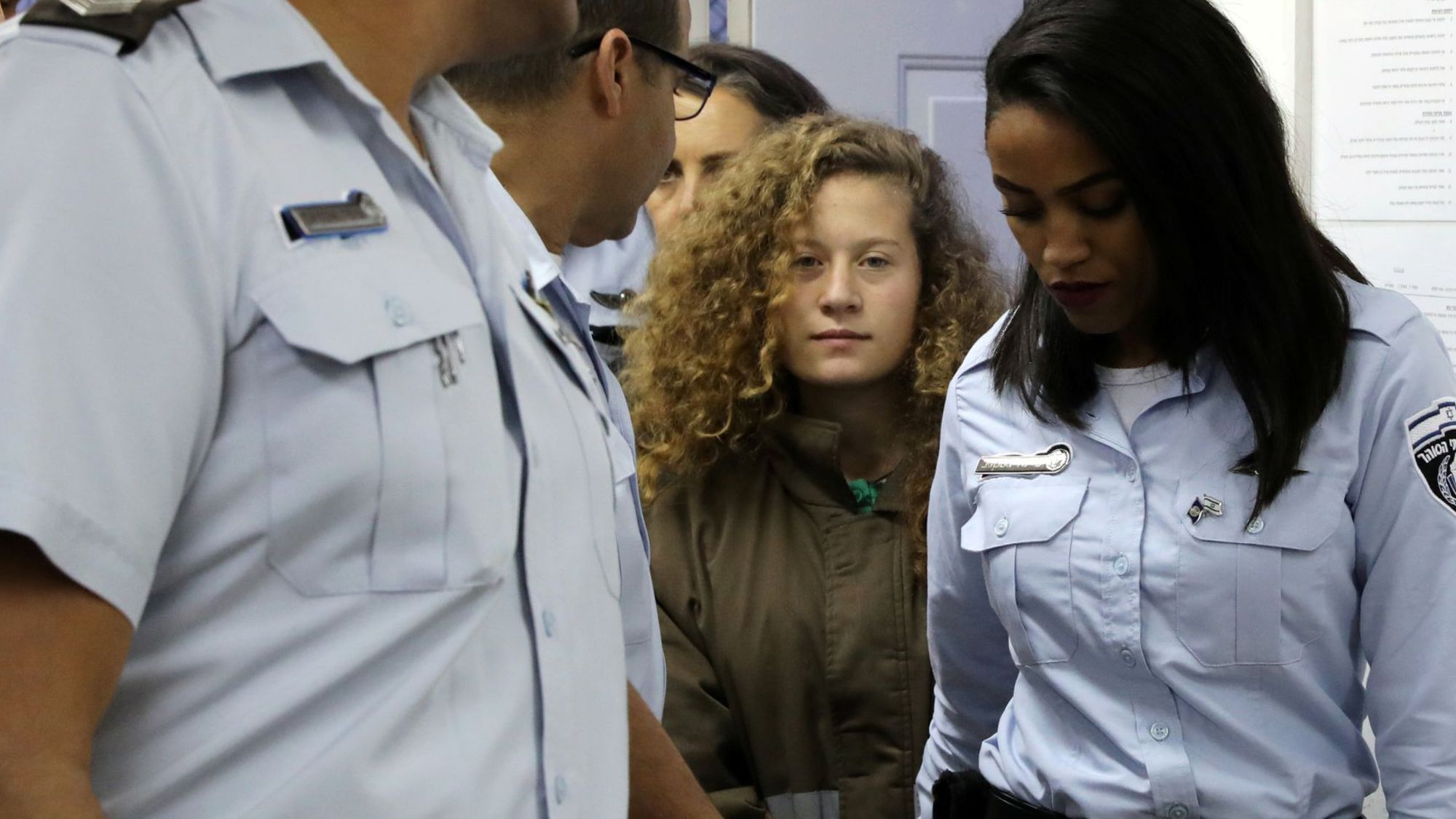 palestinian-teen-ahed-tamimi-enters-a-military-courtroom-escorted-by-israeli-prison-service-personnel-at-ofer-prison-near-the-west-bank-city-of-ramallah_5998486