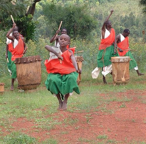 Local Gitega drummers. Small boy flying in the air Burundi © 2006 Jan Oberg, TFF