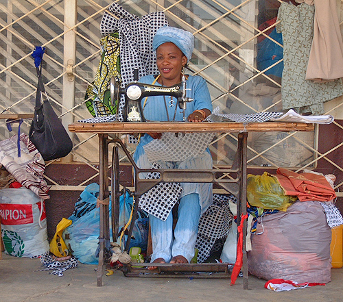 Woman sewing in the street. Bujumbura, Burundi # 1 © 2006 Jan Oberg, TFF